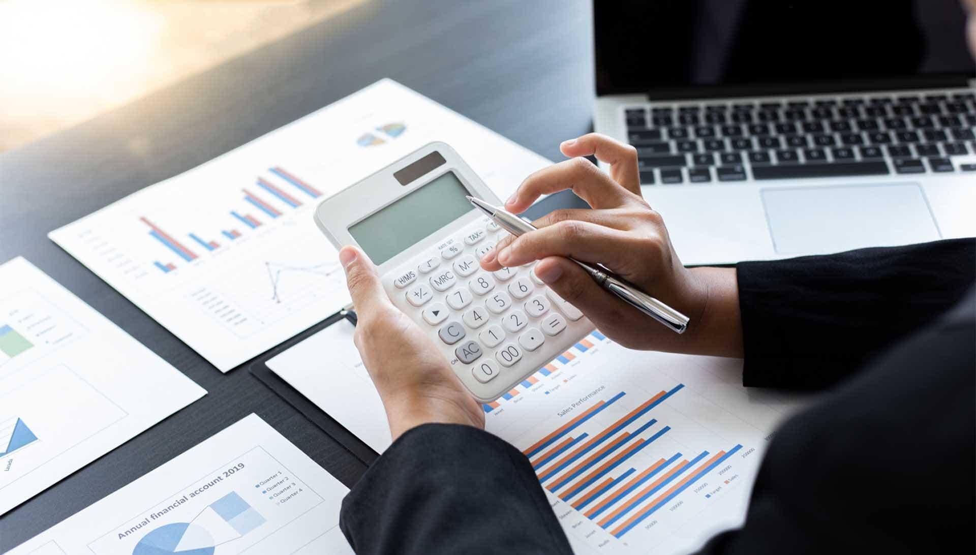 Woman calculating the finances of a small business