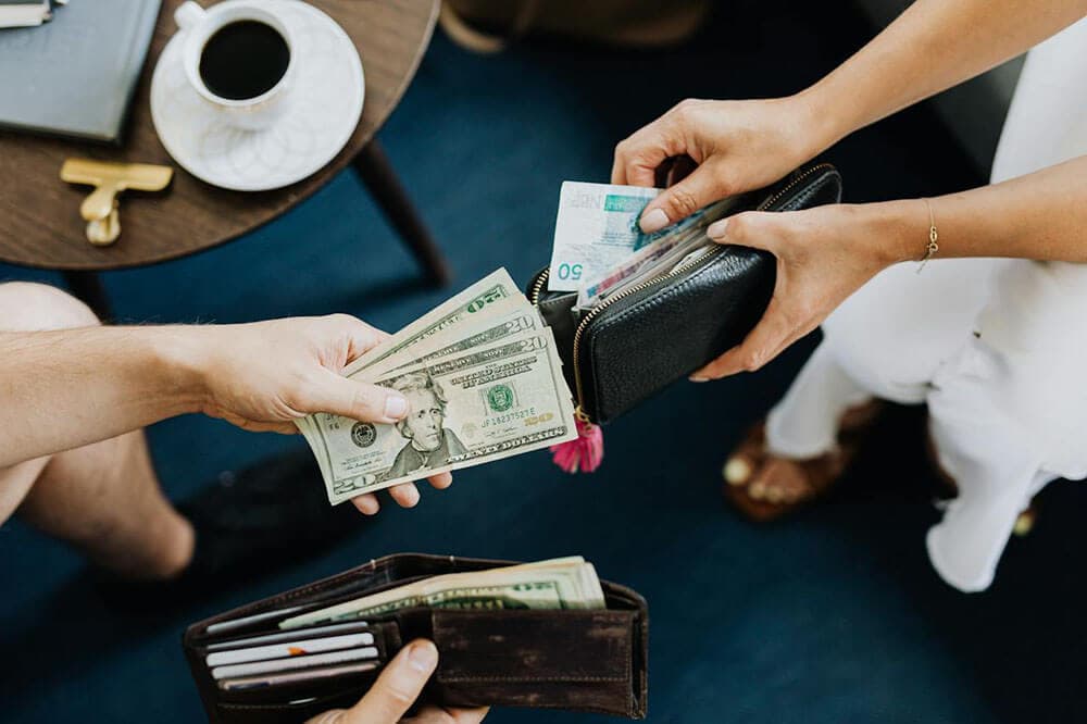 Young couple discussing money matters over coffee