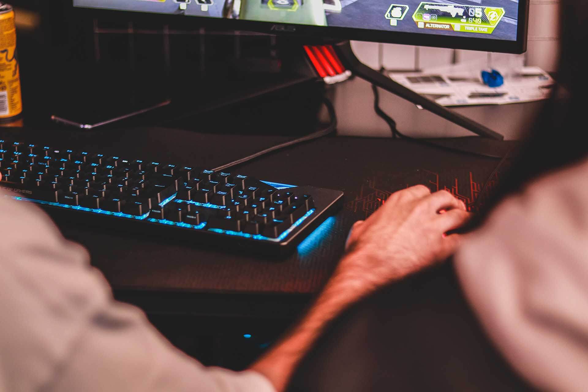 Man playing video games while streaming to Twitch as a side hustle