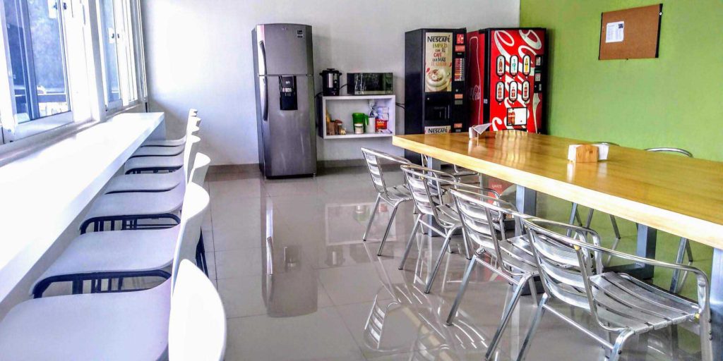 Two vending machines in the break room of an office building