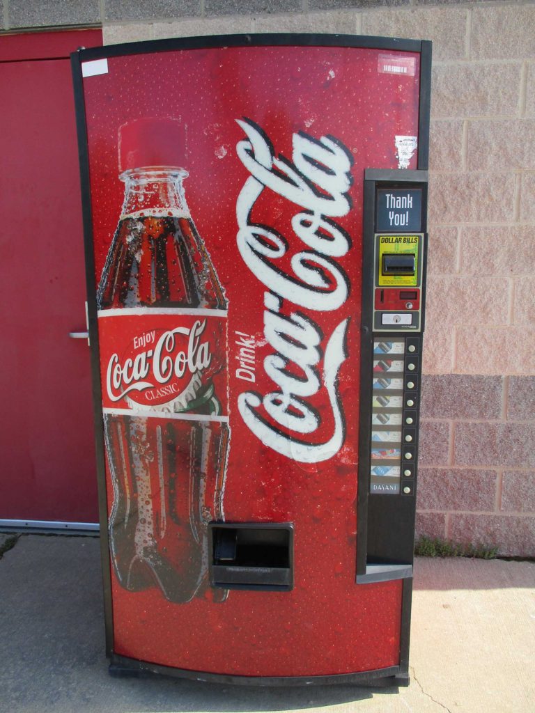 Vending machine with cold drinks including soda, water, and powerade 