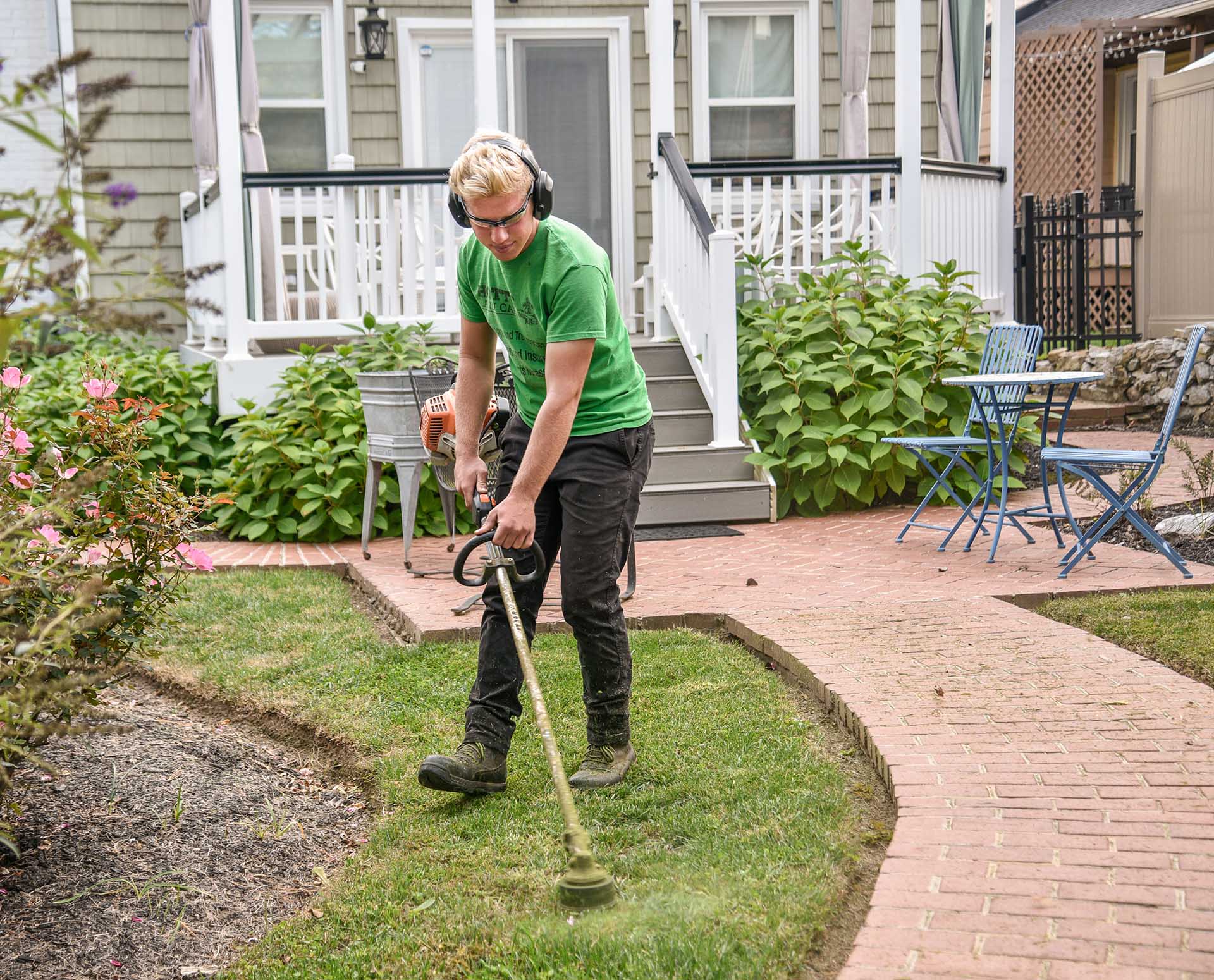 Landscaping the front yard with a string trimmer