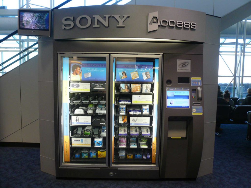 Specialty vending machine that sells portable chargers in an airport
