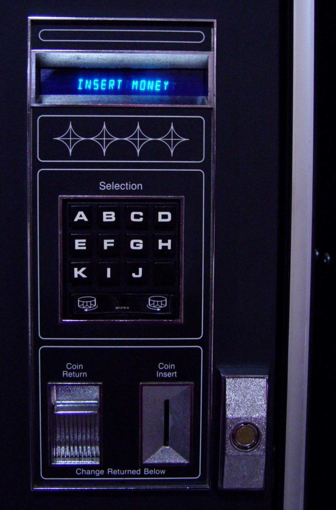 Vending machine payment system powered by coins and cash