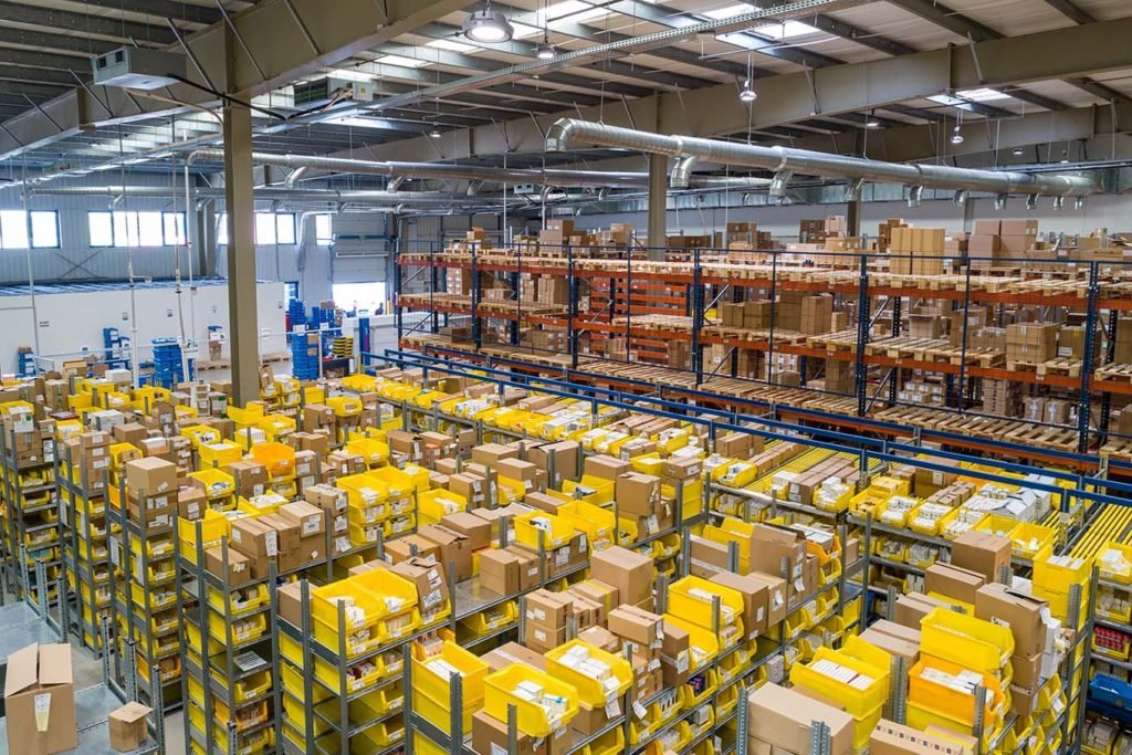 Massive warehouse filled with products and boxes for shipment