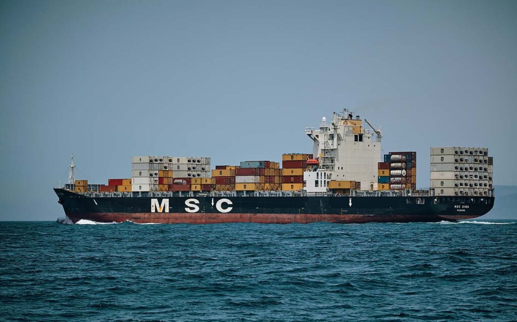 Barge with shipping containers of sea freight