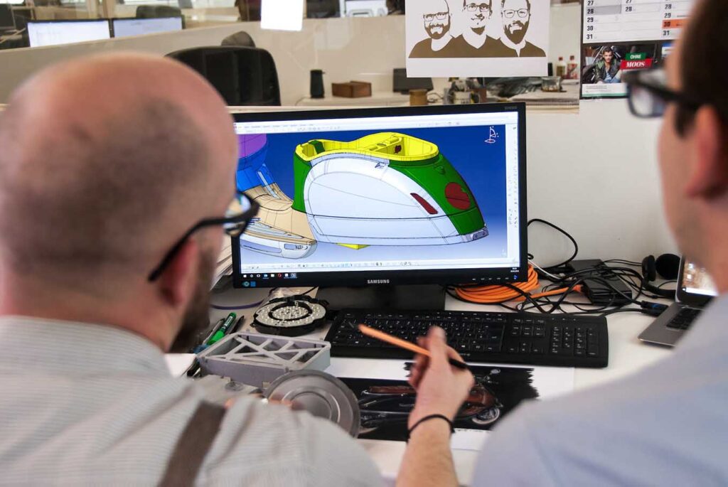 Two men demonstrating a CAD model at their SAAS startup